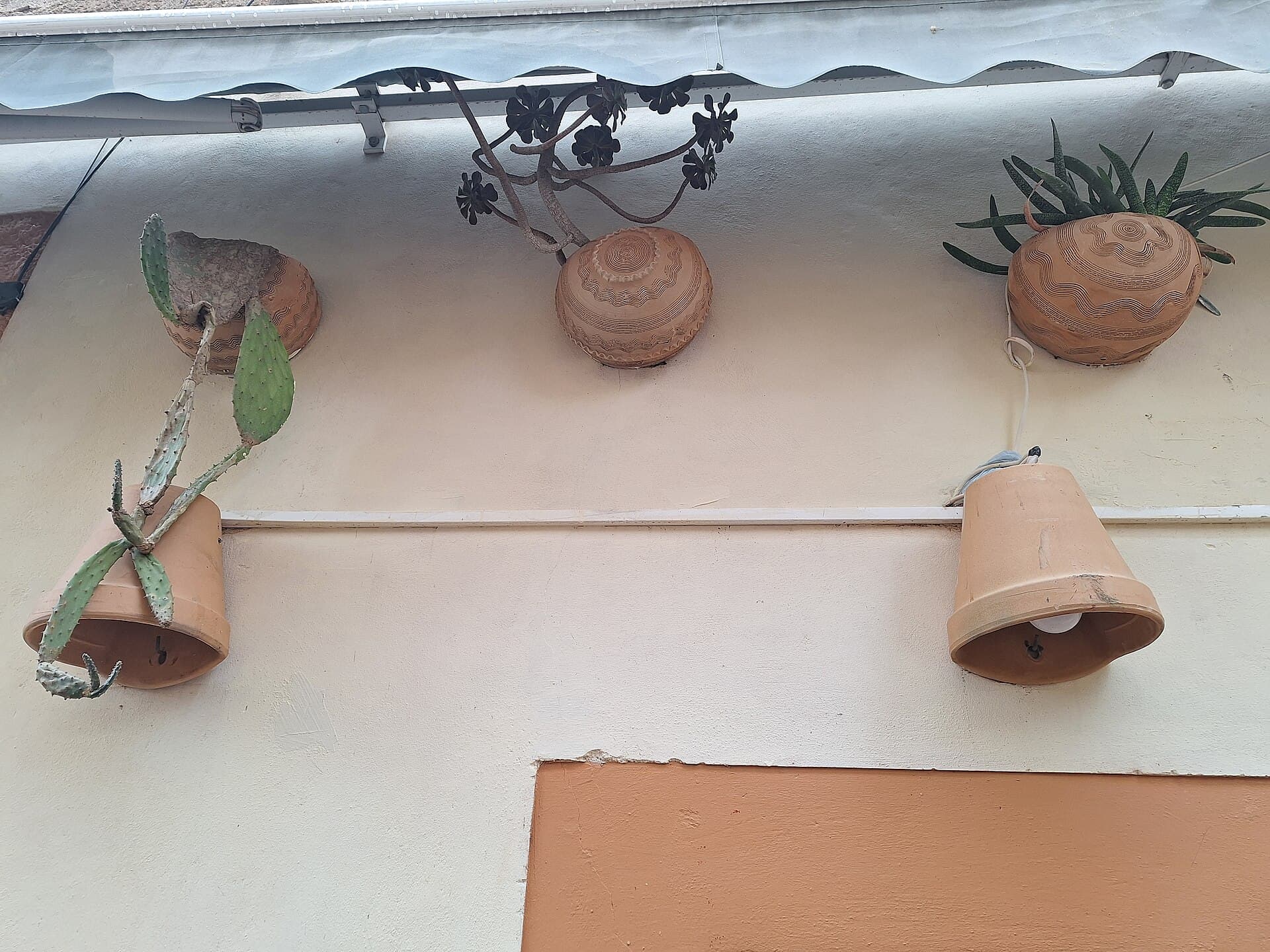 Small hanging terracotta pot on a jute hanger