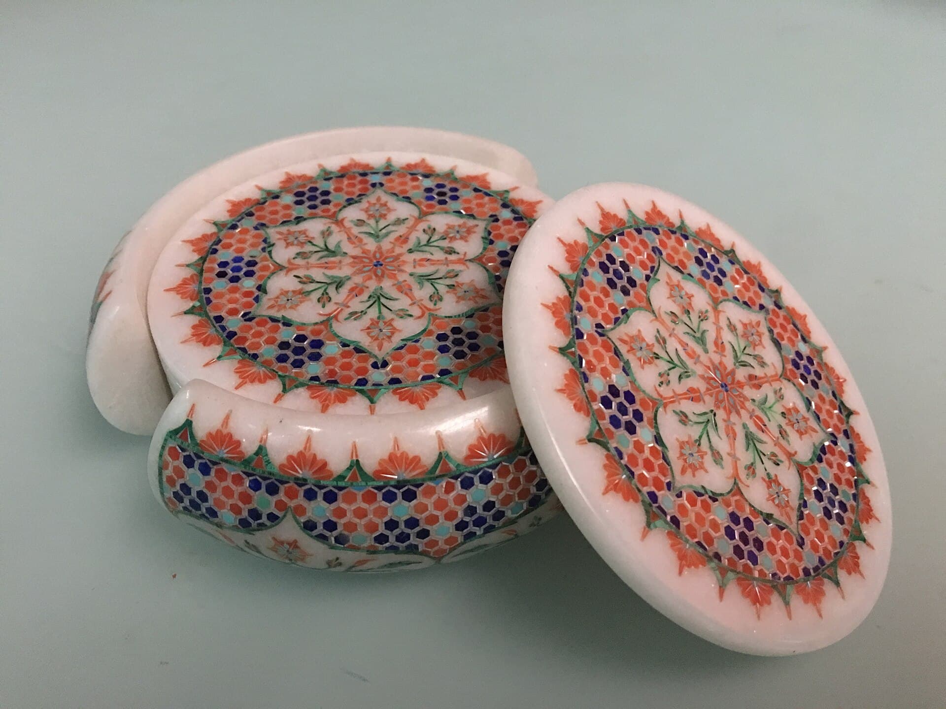Marble coasters with a stone-inlay border